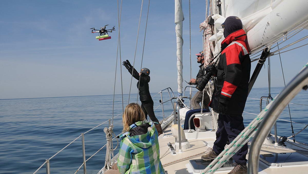 The research team launches a drone during field work in Cape Cod Bay.
(c) Véroniqe LaCapra, WHOI