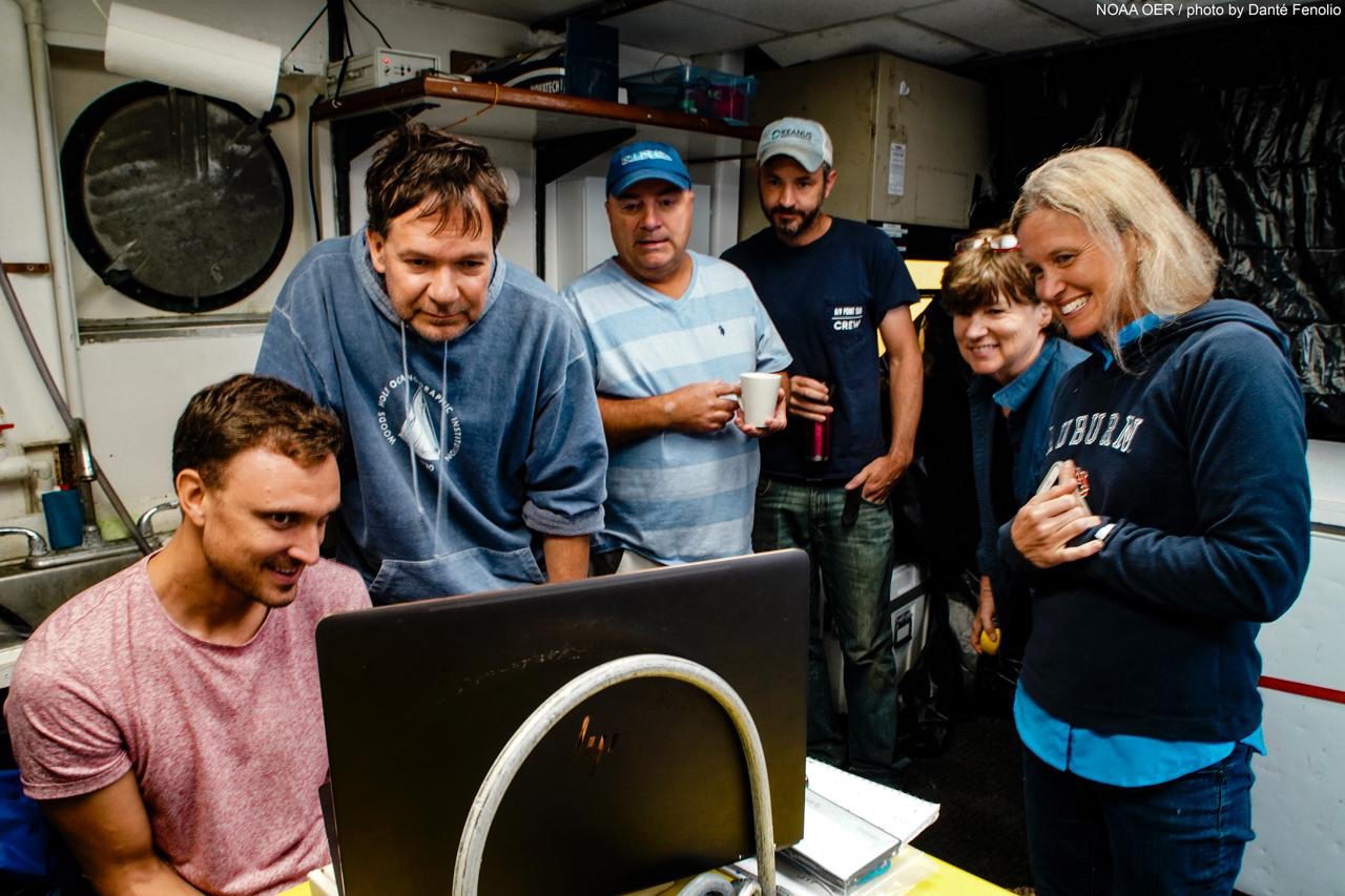 Journey into Midnight: Light and Life Below the Twilight Zone (c) From left to right: Nathan Robinson, Sonke Johnsen, Tracey Sutton, Nick Allen, Edie Aries and Megan McCall gather to watch the Giant Squid video, (c) NOAA / Dante Fenolio