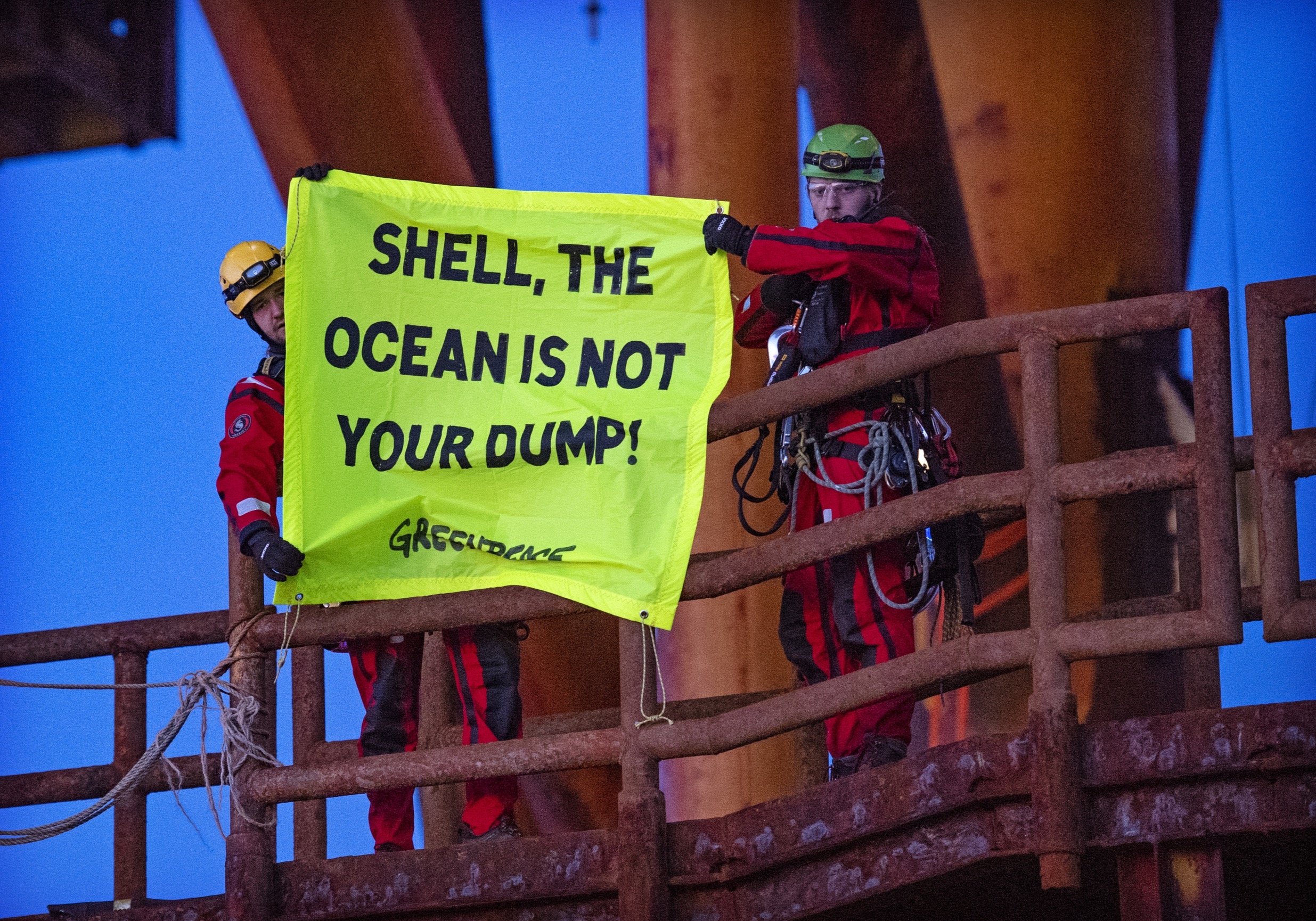 Protests on Shell Brent Oil Platforms in the North Sea (c) Climbers, supported by the Greenpeace ship Rainbow Warrior, scaled Brent Alpha and Bravo and hung banners saying, ‘Shell, clean up your mess!’ and ‘Stop Ocean Pollution’ and ‘Shell, the Ocean is not your dump’. (c) Marten  van Dijl