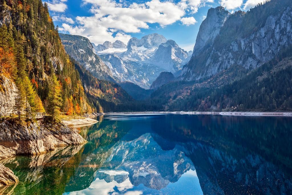 View of idyllic colorful autumn scenery with Dachstein mountain at lake Gosau (c) image©iStock-DieterMeyrl